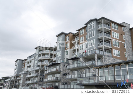 Exterior of a large apartment complex building in Tacoma, Washington 83272931