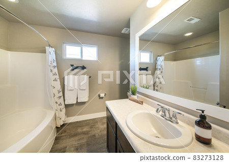 Bathroom interior with wood flooring and decorative directional arrow display on the wall Bathroom interior with wood flooring and decorative directional arrow display on the wall 83273128