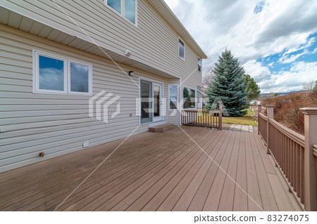 Two storey house with wooden deck overlooking the yard and scenic nature views Two storey house with wooden deck overlooking the yard and scenic nature views 83274075