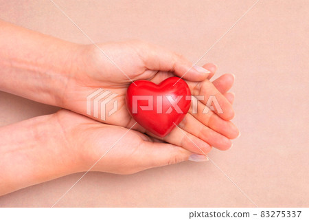 Health care concept with heart in hands 83275337