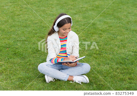 write song lyrics. happy childhood concept. kid write song lyrics. happy childhood concept. kid 83275349