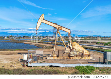 Oil derrick amid wetlands of Bolsa Chica Nature Reserve in Huntington Beach CA 83275745