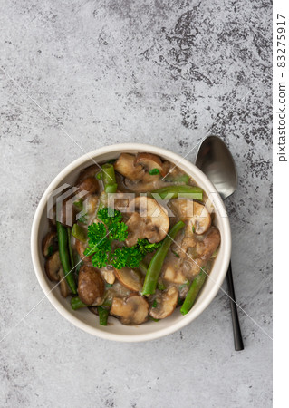 Fried brown champignons with green beans Fried brown champignons with green beans 83275917