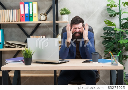 Hysterical weeping. Hysterical businessman weep in office 83275925