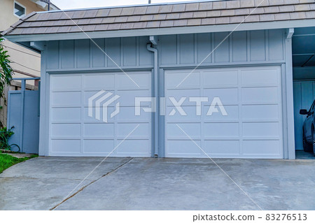 Two door garage and carport of house in San Diego California neighborhood Two door garage and carport of house in San Diego California neighborhood 83276513