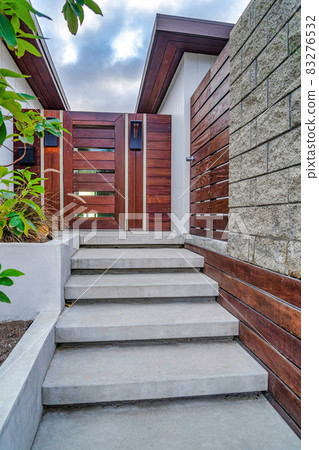 Stairs against wooden gate and door at house entrance in San Diego California Stairs against wooden gate and door at house entrance in San Diego California 83276532