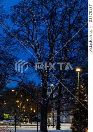 Christmas decorations in the central park of Kouvola with evening light illumination. 83278187