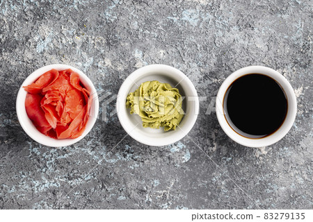 flat lay ginger wasabi soy sauce bowls. High quality and resolution beautiful photo concept flat lay ginger wasabi soy sauce bowls. High quality and resolution beautiful photo concept 83279135