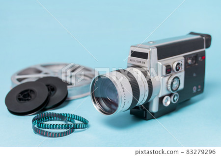 film reels film strips vintage camcorder blue background. High quality and resolution beautiful photo concept film reels film strips vintage camcorder blue background. High quality and resolution beautiful photo concept 83279296