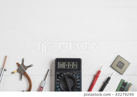 high angle view electronic tools with computer chips wooden background. High quality and resolution beautiful photo concept high angle view electronic tools with computer chips wooden background. High quality and resolution beautiful photo concept 83279299