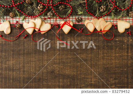 heart cookies with green branches cones. High quality and resolution beautiful photo concept heart cookies with green branches cones. High quality and resolution beautiful photo concept 83279452