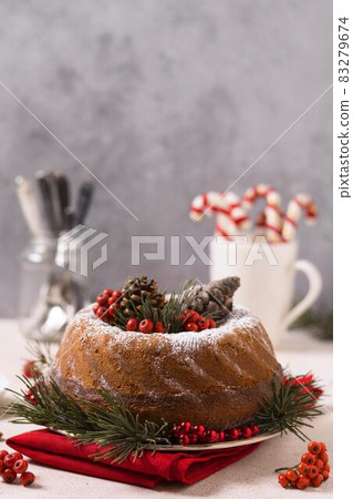 front view christmas cake with pine cones red berries. High quality and resolution beautiful photo concept front view christmas cake with pine cones red berries. High quality and resolution beautiful photo concept 83279674