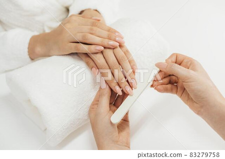 healthy beautiful manicure and manicurist with file. High quality and resolution beautiful photo concept healthy beautiful manicure and manicurist with file. High quality and resolution beautiful photo concept 83279758
