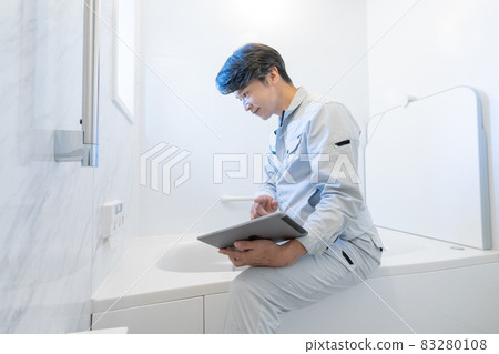 Workers inspecting the bathroom switch panel Workers inspecting the bathroom switch panel 83280108