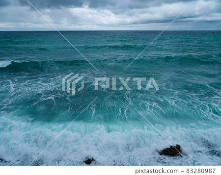 view of ocean waves and a fantastic rocky shore 83280987