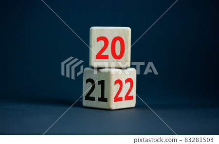 2022 happy new year symbol. Turned cubes, symbolize the change from 2021 to the new year 2022. Beautiful grey table, grey background. Copy space. Business and 2022 happy new year concept. 2022 happy new year symbol. Turned cubes, symbolize the change from 2021 to the new year 2022. Beautiful grey table, grey background. Copy space. Business and 2022 happy new year concept. 83281503