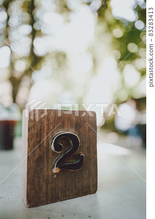 Antique number 2 on wooden cube Antique number 2 on wooden cube 83283413