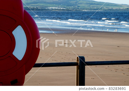 Red Lifebelt Casing on a Coastal Jetty Handrail 83283691