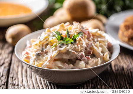 Traditional potato salad with vegetables and mayonnaise 83284030