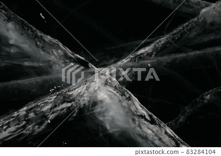 Abstract background. Screen saver on the desktop. Cross. Black and white. Abstract background. Screen saver on the desktop. Cross. Black and white. 83284104