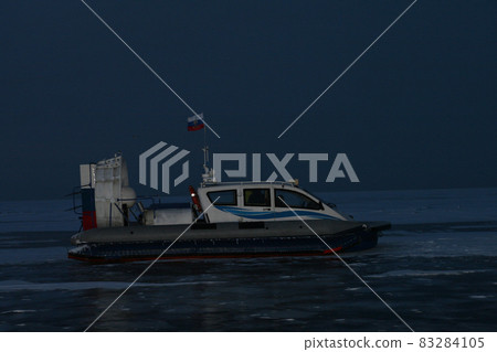 The hovercraft stands on the frozen Lake Baikal. Tourism in Russia The hovercraft stands on the frozen Lake Baikal. Tourism in Russia 83284105