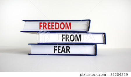 Freedom from fear symbol. Books with words 'freedom from fear'. Beautiful white background, copy space. Business, motivational and freedom from fear concept. Freedom from fear symbol. Books with words 'freedom from fear'. Beautiful white background, copy space. Business, motivational and freedom from fear concept. 83284229