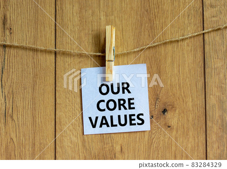 Our core values symbol. White paper with words 'Our core values', clip on wooden clothespin. Beautiful wooden background. Business and our core values concept. Copy space. Our core values symbol. White paper with words 'Our core values', clip on wooden clothespin. Beautiful wooden background. Business and our core values concept. Copy space. 83284329