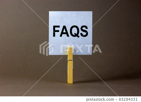 FAQS, frequently asked questions symbol. White paper on wooden clothespin. Words 'FAQS, frequently asked questions'. Beautiful grey background. Business and FAQS concept, copy space. FAQS, frequently asked questions symbol. White paper on wooden clothespin. Words 'FAQS, frequently asked questions'. Beautiful grey background. Business and FAQS concept, copy space. 83284331