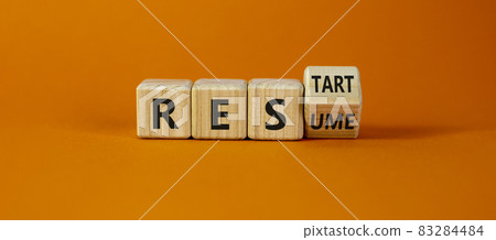 Rescue and restart symbol. Turned cubes and changed the word 'rescue' to 'restart'. Beautiful orange background. Business and rescue - restart concept. Copy space. 83284484