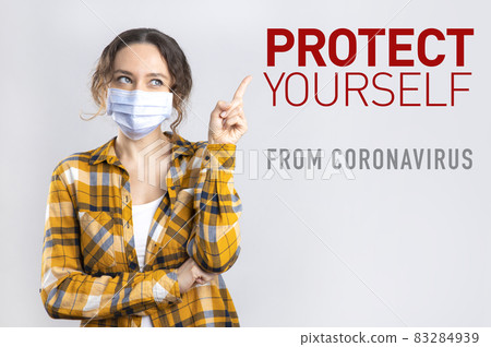 Young happy woman wearing hygienic mask to prevent infection coronavirus Young happy woman wearing hygienic mask to prevent infection coronavirus 83284939