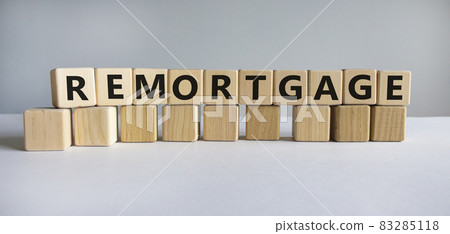 Remortgage symbol. The word 'Remortgage' written on wooden cubes. Business and remortgage concept. Copy space. Beautiful white table, white background. 83285118