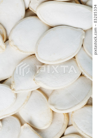 Pumpkin seeds in a shell as a textural background. 83285334
