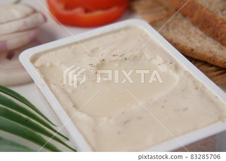 low fact cheese cream in a container on table, low fact cheese cream in a container on table, 83285706
