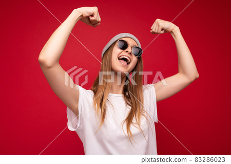 Portrait of young emotional positive happy attractive dark blonde woman with sincere emotions Portrait of young emotional positive happy attractive dark blonde woman with sincere emotions 83286023
