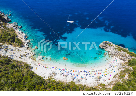 Aerial drone photo of iconic paradise sandy beach of Agiofili near port of Vasiliki with emerald crystal clear sea and sail boats docked, Lefkada island, Ionian, Greece Aerial drone photo of iconic paradise sandy beach of Agiofili near port of Vasiliki with emerald crystal clear sea and sail boats docked, Lefkada island, Ionian, Greece 83286127