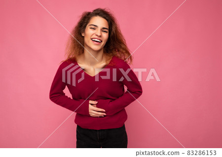 Photo of young delightful happy positive charming brunet wavy woman with sincere emotions wearing 83286153