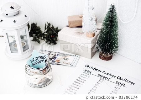 Christmas budget, Christmas Savings Challenge. Xmas savings, Savings challenge, Saving money concept with dollars bills and Savings Challenge list Christmas budget, Christmas Savings Challenge. Xmas savings, Savings challenge, Saving money concept with dollars bills and Savings Challenge list 83286174