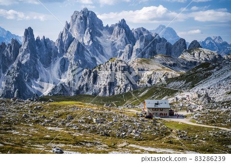 Rifugio Lavaredo with Cadini di Misurina mountain group in background. Dolomites at the Cime di Lavaredo, Italy Rifugio Lavaredo with Cadini di Misurina mountain group in background. Dolomites at the Cime di Lavaredo, Italy 83286239