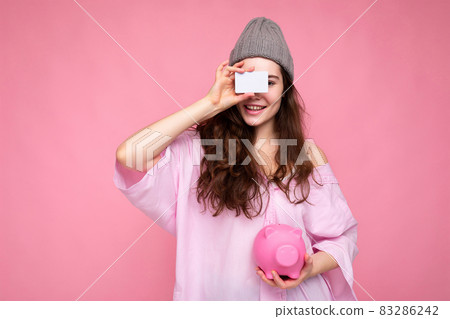 Portrait of beautiful positive cheerful cute smiling young brunette woman in stylish shirt isolated Portrait of beautiful positive cheerful cute smiling young brunette woman in stylish shirt isolated 83286242