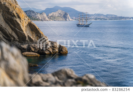 View of the sea bay and ship in the village Novyi Svit in the Crimea in autumn 83286254