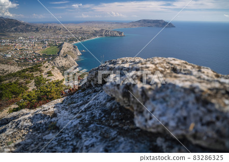 Scenic Panoramic view towards Kapsel valley and cape Meganom, Alchak, near resort city Sudak in Crimea Scenic Panoramic view towards Kapsel valley and cape Meganom, Alchak, near resort city Sudak in Crimea 83286325