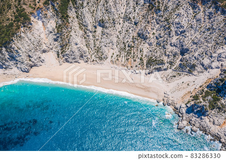Famous Platia Ammos beach in Kefalonia island, Greece. The beach was affected by the earthquake in the spring of 2014 and it is very difficult to go down on the beach 83286330