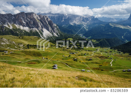 Hiking path and epic landscape of Seceda peak in Dolomites Alps, Odle mountain range, South Tyrol, Italy, Europe 83286389