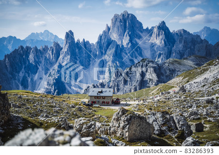 Rifugio Lavaredo with Cadini di Misurina mountain group in background. Dolomites at the Cime di Lavaredo, Italy Rifugio Lavaredo with Cadini di Misurina mountain group in background. Dolomites at the Cime di Lavaredo, Italy 83286393