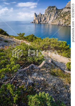 Scenic mountain Karaul-Oba nearby coastline of Black Sea. Structure formed by pre-historic corals. Shot near town Novyi Svit, Crimea Scenic mountain Karaul-Oba nearby coastline of Black Sea. Structure formed by pre-historic corals. Shot near town Novyi Svit, Crimea 83286513