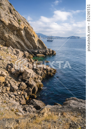 View of the sea bay and ship in the village Novyi Svit in the Crimea in autumn View of the sea bay and ship in the village Novyi Svit in the Crimea in autumn 83286531