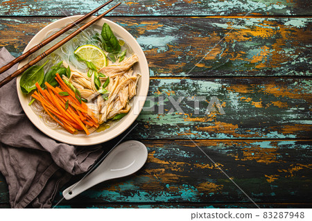 Asian soup with noodles in bowl top view copy space Asian soup with noodles in bowl top view copy space 83287948