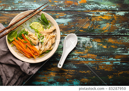 Asian soup with noodles in bowl top view copy space 83287950