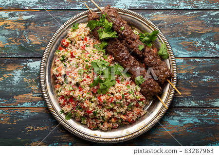 Arab Turkish kebab with tabbouleh salad Arab Turkish kebab with tabbouleh salad 83287963