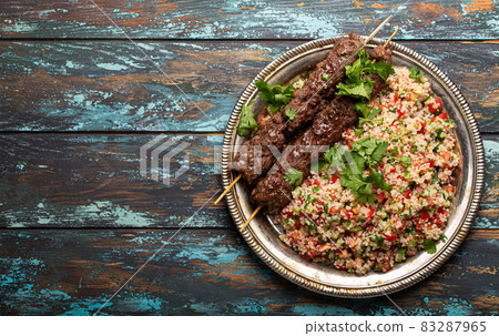 Arab Turkish kebab with tabbouleh salad Arab Turkish kebab with tabbouleh salad 83287965